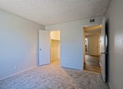 Thumbnail 20 of 30 - Unfurnished bedroom with walk-in closet at The Link Apartments, Mesa, 85201