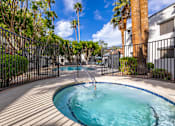 Thumbnail 13 of 16 - A small pool surrounded by a black fence.