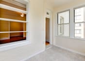 Thumbnail 15 of 39 - vacant sunroom with hardwood floors and large windows at twin oaks apartments columbia heights washington dc