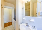 Thumbnail 7 of 21 - bathroom with vanity, closet and tile flooring at the cortland apartments in washington dc
