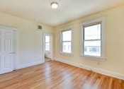 Thumbnail 16 of 39 - vacant bedroom with hardwood floors, and large windows at twin oaks apartments columbia heights washington dc