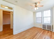 Thumbnail 14 of 21 - vacant bedroom with hardwood flooring and ceiling fan at the cortland apartments in washington dc