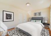 Thumbnail 10 of 19 - bedroom with bed, windows and hardwood floors 1401 sheridan apartments in washington dc