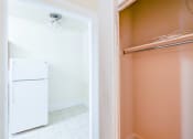 Thumbnail 3 of 23 - hallway view of kitchen and closet at chatham courts apartments in washington dc