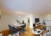 Thumbnail 2 of 19 - living area with sofa, coffee table, credenza, tv, hardwood floors and view of dining area at clarence house apartments in washington dc