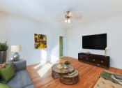 Thumbnail 5 of 23 - living area with sofa, coffee table, credenza, tv, hardwood floors and ceiling fan at chatham courts apartments in washington dc