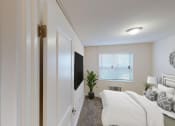 Thumbnail 7 of 15 - bedroom with bed, nightstand, tv, window and lighting at manor village  tax credit apartments in washington dc