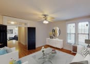 Thumbnail 2 of 21 - living area with sofa, coffee table, large windows, ceiling fan and view of a bedroom at the cortland apartments in washington dc