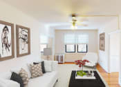 Thumbnail 5 of 28 - living area with sofa, seating area, coffee table, modern artwork and ceiling fan at the klingle apartments in washignton dc