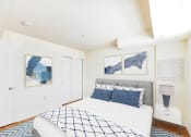 Thumbnail 7 of 14 - bedroom with bed, nightstand, and closet at jasper place apartments in washington dc