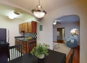 Thumbnail 3 of 12 - dining area with table, chairs, view of kitchen and living area at 2801 pennsylvania apartments in washington dc