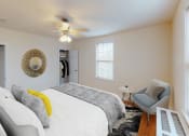 Thumbnail 3 of 21 - bedroom with bed, sitting area, large windows and ceiling fan at 6100 14th street in washington dc