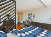 Thumbnail 9 of 47 - studio apartments showing bed, sofa and front entrance at brunswick house apartments in dupont circle washington dc