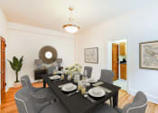 Thumbnail 2 of 26 - dining area with table, chairs, modern artwork and view of kitchen  at 2800 ontario road apartments in washington dc