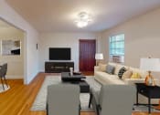 Thumbnail 2 of 27 - a living room with white walls and hardwood floors