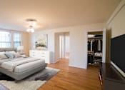 Thumbnail 11 of 21 - a bedroom with a bed and a dresser at 3101 Pennsylvania apartments in washington dc