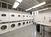 Thumbnail 12 of 20 - laundry rom at the baystate apartments in washington dc