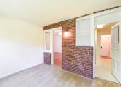 Thumbnail 17 of 27 - vacant sunroom with exposed brick  at  2629 39th Street apartments in washington dc