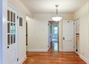 Thumbnail 24 of 27 - hallway with view of bedroom, sunroom and bathroom at 2629 39th Street apartments in washington dc
