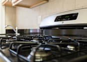 Thumbnail 4 of 26 - close up of gas range at 2701 Connecticut apartments in washington dc