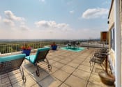 Thumbnail 17 of 20 - Sherry hall roof deck with loungers and table seating in Washington DC