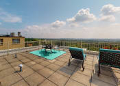 Thumbnail 16 of 20 - Sherry Hall roofdeck with loungers and a view of the National Cathedral in Washington DC