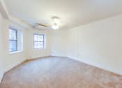 Thumbnail 22 of 26 - vacant bedroom with plush carpeting, windows and ceiling fan at 2800 ontario apartments in washington dc