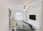 Thumbnail 9 of 40 - bedroom with bed, nightstands, large window and ceiling fan at 2800 woodley apartments in washington dc