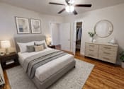 Thumbnail 6 of 16 - A bedroom with a large bed, a dresser, and a ceiling fan.
