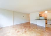 Thumbnail 20 of 39 - vacant living area with hard wood flooring and view of kitchen  at twin oaks apartments columbia heights washington dc