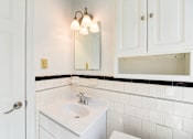 Thumbnail 13 of 21 - bathroom with cabinet, vanity, sink and mirror at 3101 Pennsylvania apartments in washington dc