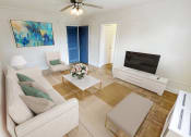 Thumbnail 4 of 33 - a living room with a couch and a tv