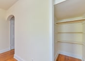 Thumbnail 8 of 16 - hallway closet with built in shelving at 4020 calvert street apartments in washington dc