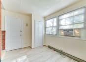 Thumbnail 14 of 16 - sunroom with exposed brick wall and woodlike flooring at 4020 calvert street apartments in washington dc