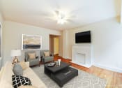 Thumbnail 8 of 18 - living area with sofa, coffee table hardwood floors and ceiling fan at 4031 davis place apartments in washington dc