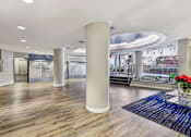 Thumbnail 6 of 37 - A large room with a wooden floor and a long white column.