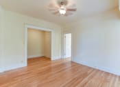 Thumbnail 13 of 39 - vacant bedroom with hardwood floors, large closet and ceiling fan  at twin oaks apartments columbia heights washington dc
