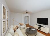 Thumbnail 1 of 21 - living area with sofa, coffee table, credenza, tv, ceiling fan and hardwood flooring at 6100 14th Street apartments in washington dc