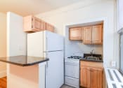Thumbnail 10 of 21 - kitchen with large windows and energy efficient appliances at the cortland apartments in washington dc