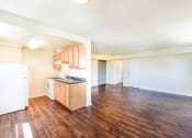 Thumbnail 10 of 18 - vacant living area with hardwood flooring and view of kitchen at 734 longfellow street apartments in washington dc