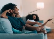 Thumbnail 7 of 28 - Sisters watching a movie in apartment