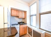 Thumbnail 9 of 21 - kitchen with large windows and energy efficient appliances at the cortland apartments in washington dc