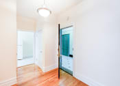 Thumbnail 13 of 23 - foyer of apartment with modern lighting and hardwood flooring at chatham courts apartments in washington dc