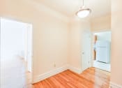 Thumbnail 14 of 23 - hallway with modern lighting and view of kitchen at chatham courts apartments in washington dc