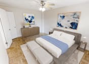 Thumbnail 5 of 33 - a bedroom with a bed and a ceiling fan