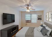 Thumbnail 6 of 16 - bedroom with bed, nightstands, dresser, tv, ceiling fans and large windows at alpha house apartments in washington dc