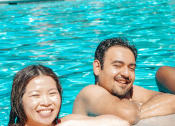 Thumbnail 26 of 27 - friends hanging out in swimming pool