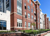 Thumbnail 21 of 21 - exterior of brick apartment building at archer park apartments in southeast Washington dc