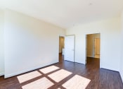 Thumbnail 9 of 21 - vacant bedroom with hardwood flooring, closet and view of bathroom at archer park apartments in washington dc