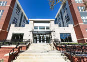 Thumbnail 1 of 21 - exterior of midrise apartment building at archer park apartments in southeast dc